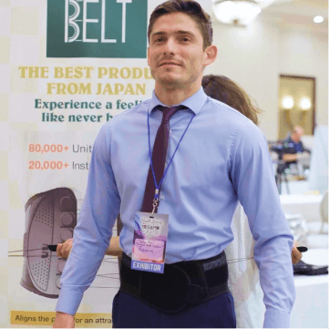 man with suit trying out guardner belt